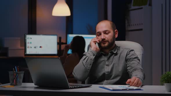 Stressed Angry Businessman Sitting at Desk Table Discussing Corporate Problem alt