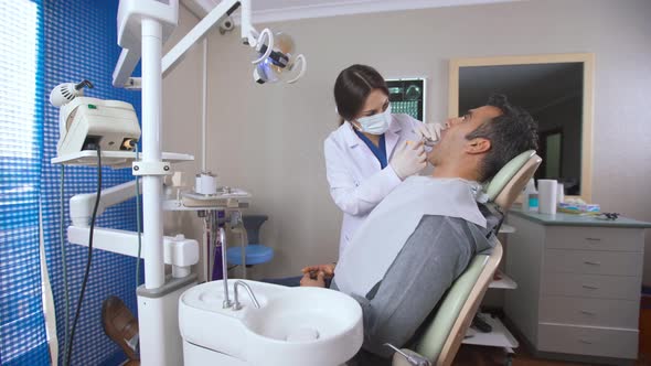 Dentist making injections. alt