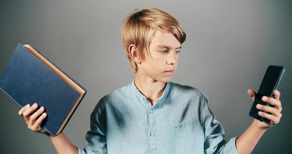 Boy Choosing Book and Smartphone Isolated