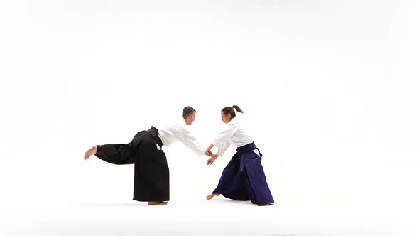 Male, Female in Kimono Performing Aikido Techniques, Isolated on White alt