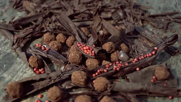 Truffles in Dark Chocolate With Red Pepper and Chocolate Chips. alt