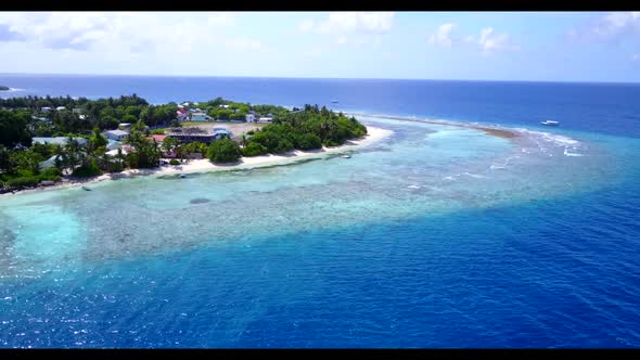 Aerial top view travel of beautiful coast beach holiday by blue lagoon with bright sandy background  alt