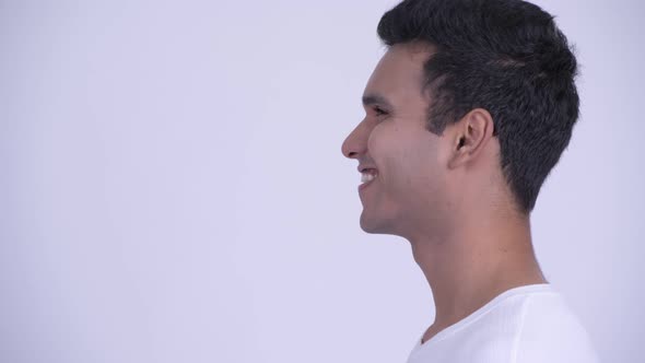 Closeup Profile View of Happy Young Indian Man Thinking alt