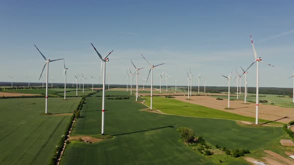 A Drone Shot of a Massive Wind Farm in Agricultural Land alt