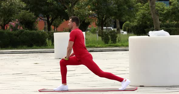 Man warm up and stretching outdoors for a workout.