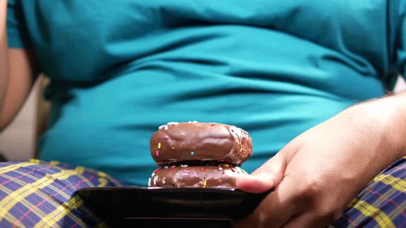 Young Man Eating Donut  Selective Focus