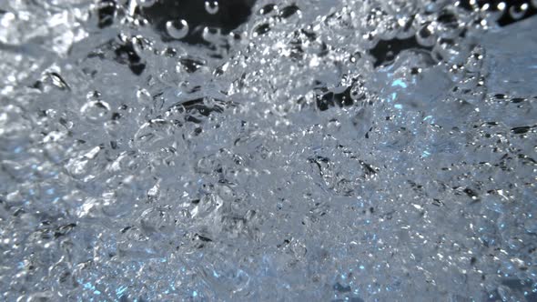 Super Slow Motion Macro Shot of Air Bubbles Flowing in Water at 1000 Fps alt