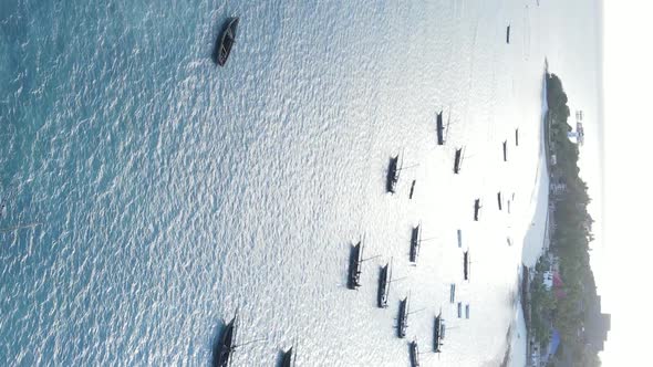 Tanzania Vertical Video  Boat Boats in the Ocean Near the Coast of Zanzibar Aerial View alt