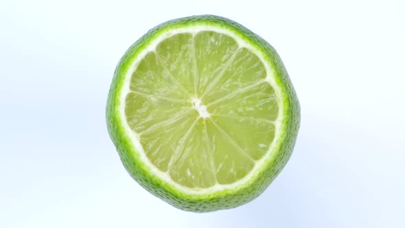 Rotate Half Lime Isolated on White Background