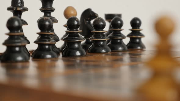 Starting positions of wooden chessmans on chequered fields 4K 2160p 30fps UltraHD  footage - Row of  alt