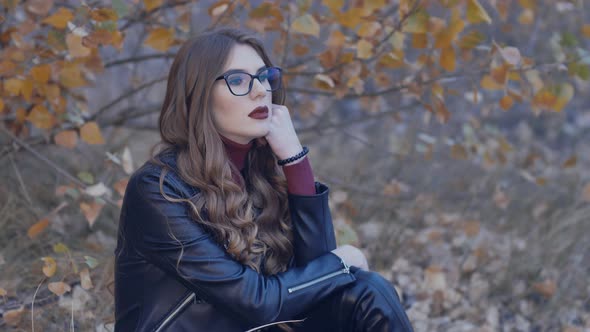 Beautiful Girl Smokes an Electronic Cigarette alt