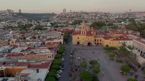 Templo y Convento de la Santa Cruz de los Milagros And Plaza de los Fundadores During Sunset In Sant alt