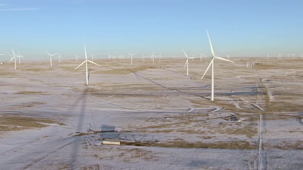 Aerial shots of wind turbines on a cold winter afternoon in Calhan, Colorado alt