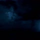 Thunderstorm Clouds at Night with Lightning