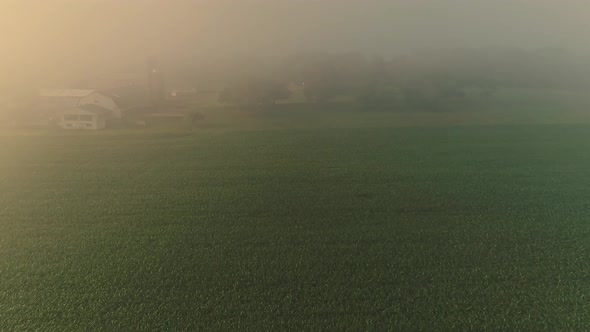 Aerial View of a Foggy Morning Looking Over Pennsylvania Farmland, Fields alt