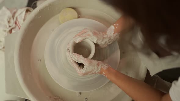 Ceramist Making Clay Vase on Pottery Wheel