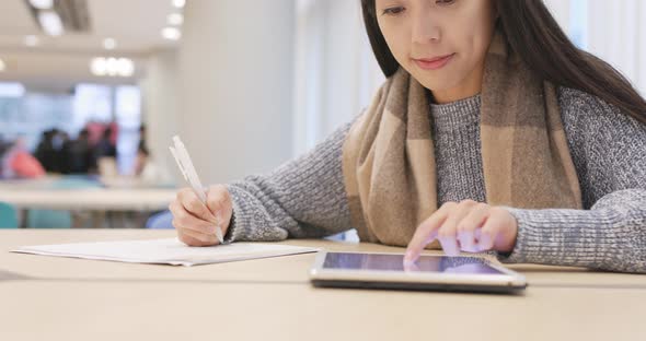 Student doing her homework alt