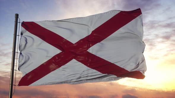 Flag of Alabama Waving in the Wind Against Deep Beautiful Sky at Sunset alt