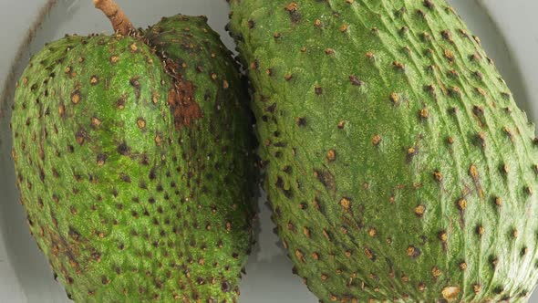 Closeup of Green Soursop Graviola, Exotic, Tropical Fruit Guanabana on Plate alt