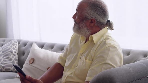 Mature couple enjoying time at home alt