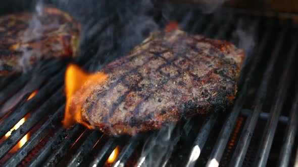 High Quality Video of Steaks on The Grill Being Grilled with Flames in Real Slow Motion 120fps alt