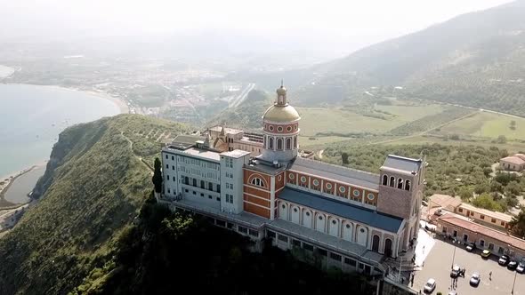 Drone flight over the sanctuary of Tindari, Sicily, Italy with the mediterranean Sea in the backgrou alt