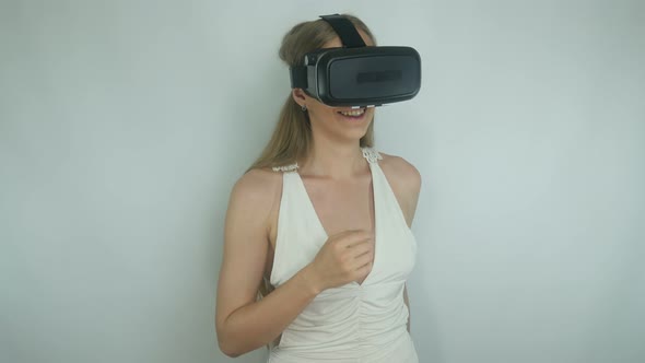 Beautiful Girl Uses Virtual Reality Helmet App