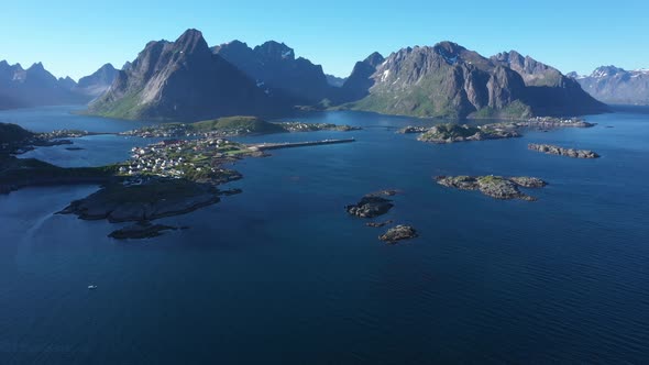 Flight over the sea and view on the fishing village Reine and Hamnoya ,Lofoten Islands,Norway
