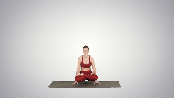 Young sporty woman practicing yoga doing Scale exercise, alt