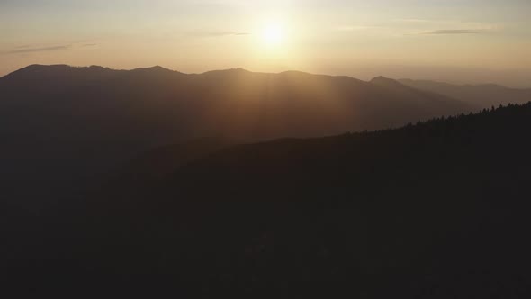 Orange Sunset Over Mountain Ridge Silhouette in the Alps