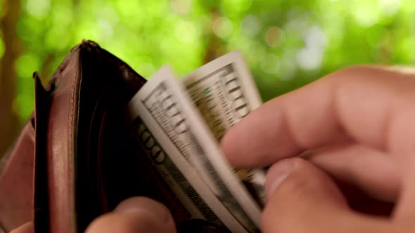 Fingers Recalculating Bank Notes Ben Franklin with Sign 100 $