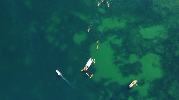 Aerial drone view of boats and kayaks in the Atlantic Ocean. Travel and adventure. Nomad life