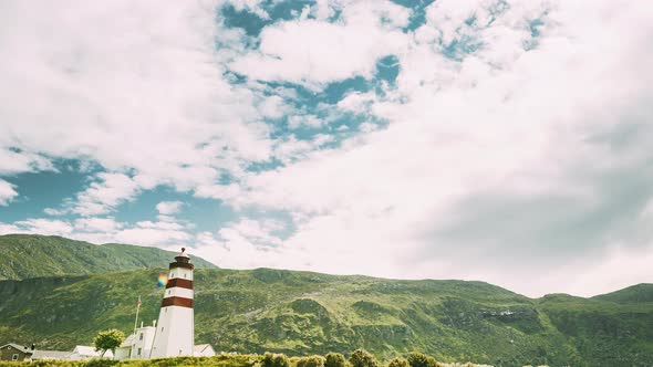 Alnesgard, Godoya, Norway. Old Alnes Lighthouse In Summer Day In Godoy Island Near Alesund Town alt