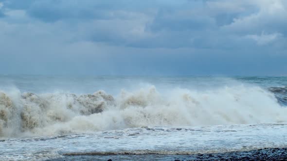 Big Sea Waves Crashing on the Shore Blue Water Background