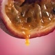 Slow Motion Macro Shot of Flowing Passion Fruit Maracuya Juice From Halved Maracuya - VideoHive Item for Sale