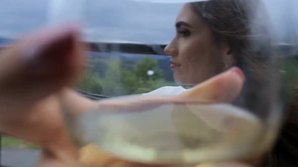 the Girl Drinks White Wine Sexy Young Woman with Glass of Wine alt