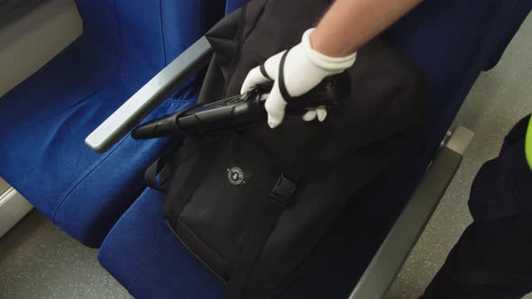 A Special Security Service on Railway Transport Checks a Backpack Forgotten By a Passenger Using a