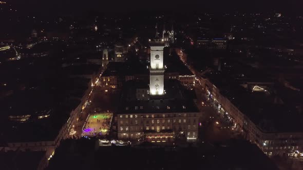 Arial City Lviv Ukraine Rynok Square Town Hall Christmas Fair People Skate on Ice Skating Rink alt