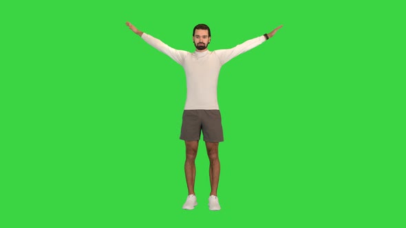 Healthy Man Rotating Hands to Warm Up Shoulders on a Green Screen Chroma Key alt