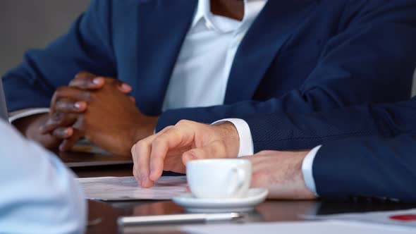 Office concept: two men actively discussing a business project alt