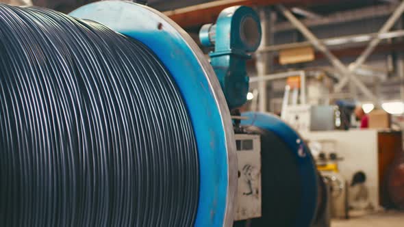 Spinning Reel with Cable in Cable Production Plant Closeup