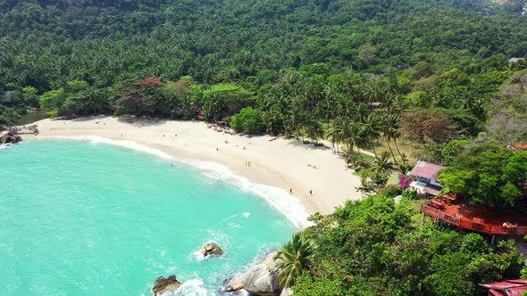 Tropical drone island view of a sunshine white sandy paradise beach and aqua blue ocean background i alt