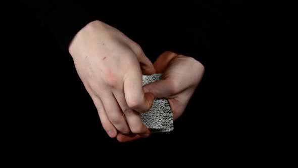 Trick of Magician with Cards - the Same Card, on Black, Close Up alt