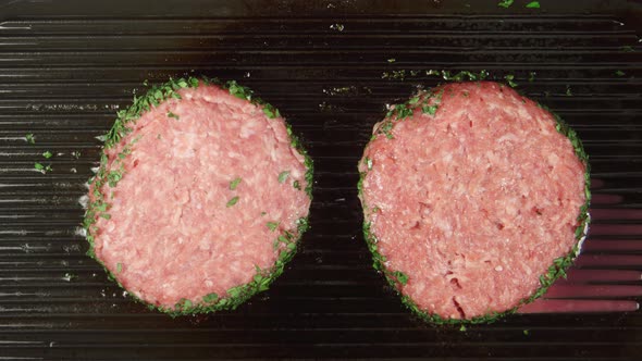 Two Beefsteaks Fry On A Grill
