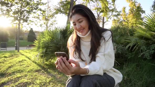 Slow Motion Closeup of Beautiful Young Business Asian Woman with Smartphone Texting Messenger with