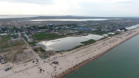 Aerial of Straight Black Sea Coast with Many Lakes, White Sand and Weeds