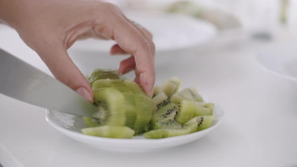 Cutting Kiwi for Healthy Breakfast or Snack