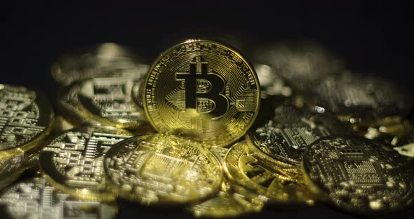 Cryptocurrency Real Golden Coins With Bitcoin Logo On Black Background