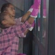 Girls Washing Window Glass with Cleaning Supplies - VideoHive Item for Sale