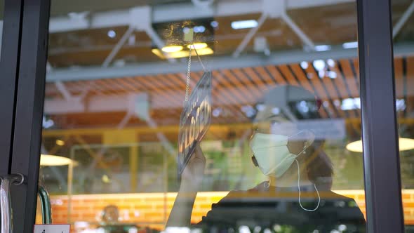 business owner stressful hand handing shop close again from spread of covid-19 alt